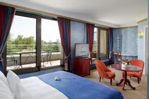 Ένα ή περισσότερα κρεβάτια σε δωμάτιο στο Hotel Parc Belair