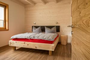 מיטה או מיטות בחדר ב-Panoramahof am Goldberg