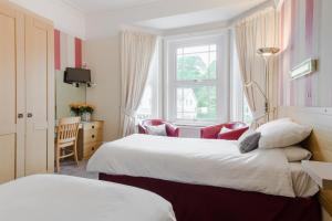 Ένα ή περισσότερα κρεβάτια σε δωμάτιο στο Cheriton Guesthouse