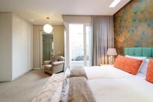 Ένα ή περισσότερα κρεβάτια σε δωμάτιο στο Thirty On Grace +59 φωτογραφίες