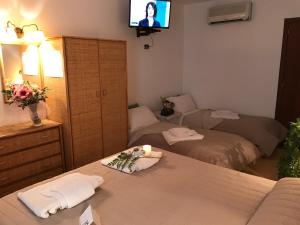Postel nebo postele na pokoji v ubytování Hotel La Playa Blanca