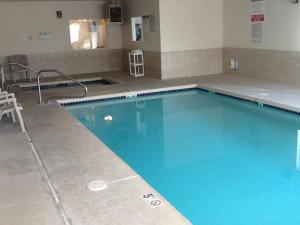 a large blue swimming pool in a building at Motel 6-Nephi, UT in Nephi