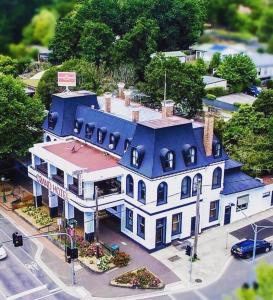 a large white house with a blue roof at Grand Hotel Healesville in Healesville