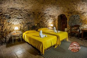Posteľ alebo postele v izbe v ubytovaní Casa Cueva El Mimo