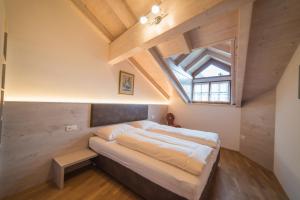 Ein Bett oder Betten in einem Zimmer der Unterkunft Jagerhof
