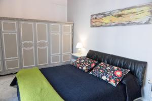 Postel nebo postele na pokoji v ubytování Yucca Camere & Suite