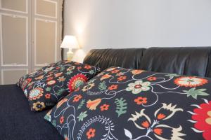 Postel nebo postele na pokoji v ubytování Yucca Camere & Suite