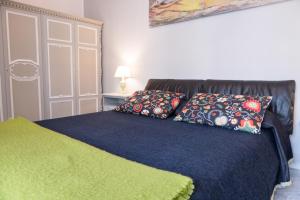 Postel nebo postele na pokoji v ubytování Yucca Camere & Suite