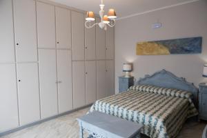 Postel nebo postele na pokoji v ubytování Yucca Camere & Suite