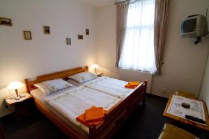 Postel nebo postele na pokoji v ubytování Pension Abbazia