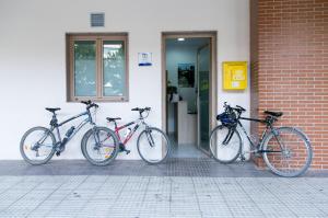 bicycles parked in front of a building at Albergue Albas exclusivo Peregrinos in Logroño