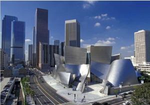 a large building in a city with tall buildings at Eastsider Motel -Downtown LA New Rooms in Los Angeles