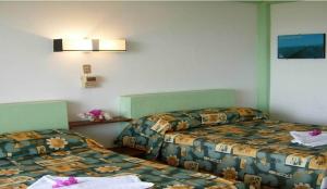 Angel del Mar tesisinde bir odada yatak veya yataklar