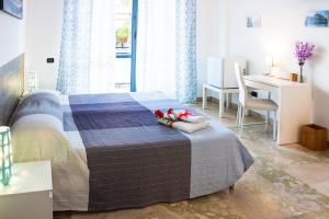 Postel nebo postele na pokoji v ubytování Darrè