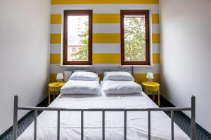 Posteľ alebo postele v izbe v ubytovaní Inbed Hostel