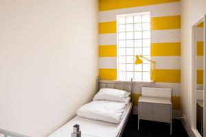 Posteľ alebo postele v izbe v ubytovaní Inbed Hostel