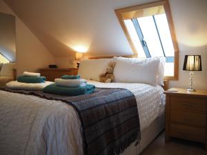 Säng eller sängar i ett rum på Decca - Self Catering Shetland