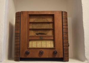an old wooden cabinet is shown in a wall at Eleonora Room & Breakfast in Oristano