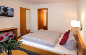 Letto o letti in una camera di Pension Arcade