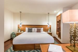 Postel nebo postele na pokoji v ubytování Edelmira Hotel Boutique