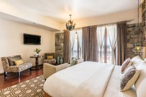 Postel nebo postele na pokoji v ubytování Edelmira Hotel Boutique
