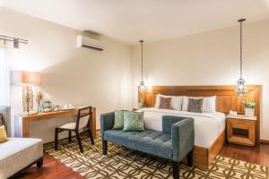 Postel nebo postele na pokoji v ubytování Edelmira Hotel Boutique