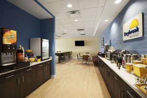 an office with a cafeteria with a counter and a dining room at Sleep Inn & Suites Altoona North in Altoona