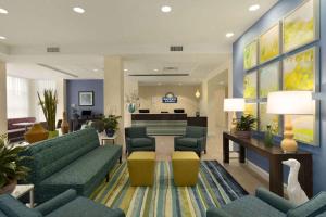 a hospital lobby with couches and a waiting room at Sleep Inn & Suites Altoona North in Altoona