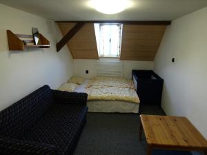 Postel nebo postele na pokoji v ubytování Hospůdka Na Perlíčku - Prdek