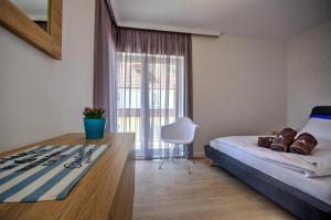Ένα ή περισσότερα κρεβάτια σε δωμάτιο στο Apartamenty Nautica blisko plaży