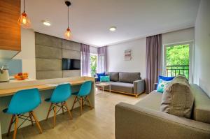 Μια τηλεόραση ή/και κέντρο ψυχαγωγίας στο Apartamenty Nautica blisko plaży