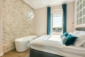 Posteľ alebo postele v izbe v ubytovaní Magic View Apartments