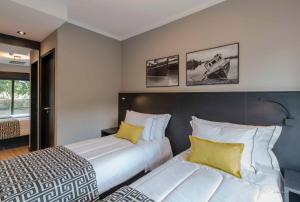 I am Design Hotel Campinas by Hotelaria Brasil客房内的一张或多张床位