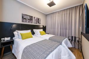 I am Design Hotel Campinas by Hotelaria Brasil客房内的一张或多张床位
