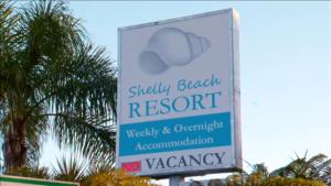 a sign forshaw beach resort and override accountability at Shelly Beach Resort in Port Macquarie