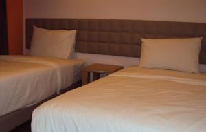 Letto o letti in una camera di GM City Hotel