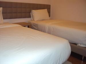 Letto o letti in una camera di GM City Hotel