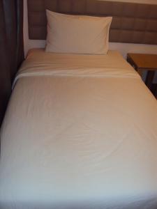 Letto o letti in una camera di GM City Hotel
