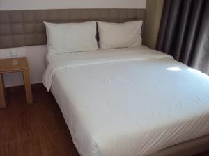 Letto o letti in una camera di GM City Hotel