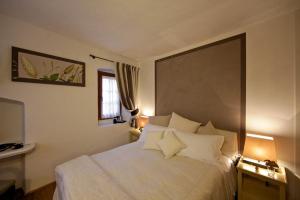 A bed or beds in a room at Maison Bondaz & SPA privé