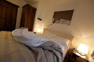 A bed or beds in a room at Maison Bondaz & SPA privé
