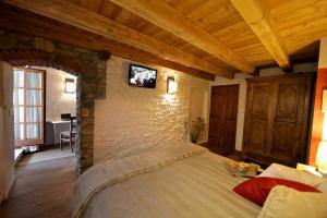 A bed or beds in a room at Maison Bondaz & SPA privé