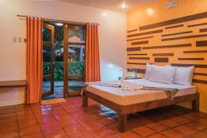 Posteľ alebo postele v izbe v ubytovaní Acacia Tree Garden Hotel