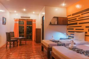 Posteľ alebo postele v izbe v ubytovaní Acacia Tree Garden Hotel