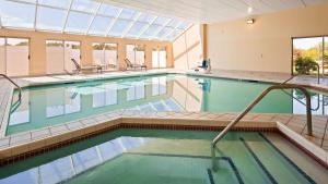 a large swimming pool with a glass ceiling at Best Western Resort Hotel & Conference Center Portage in Portage