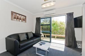 A seating area at Matakana Motel