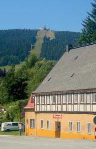 a large building on the side of a road at Ferienhaus Kaufmanns Cafe in Kurort Oberwiesenthal
