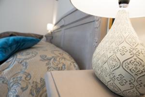 Postel nebo postele na pokoji v ubytování Yucca Camere & Suite