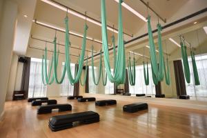 a gym with green chandeliers hanging from the ceiling at Xijiao State Guest Hotel in Shanghai