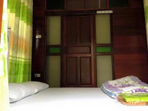 Postel nebo postele na pokoji v ubytování Sarocha Resort Rayong + 7 fotografií